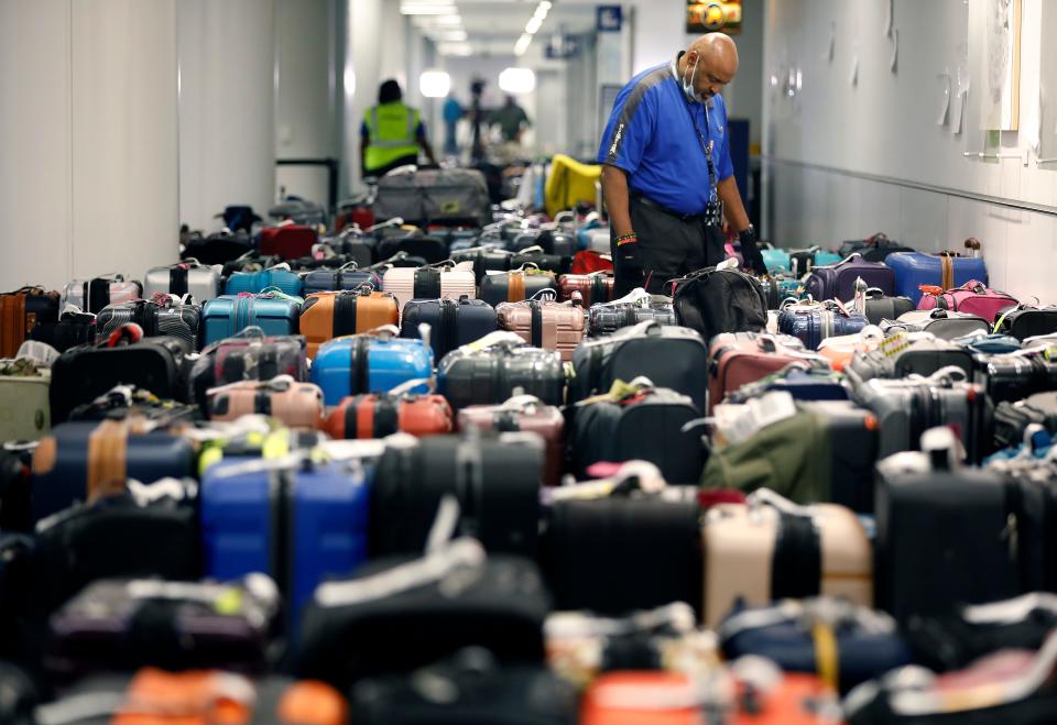 Piles of unclaimed luggage build up at LAX on December 28.