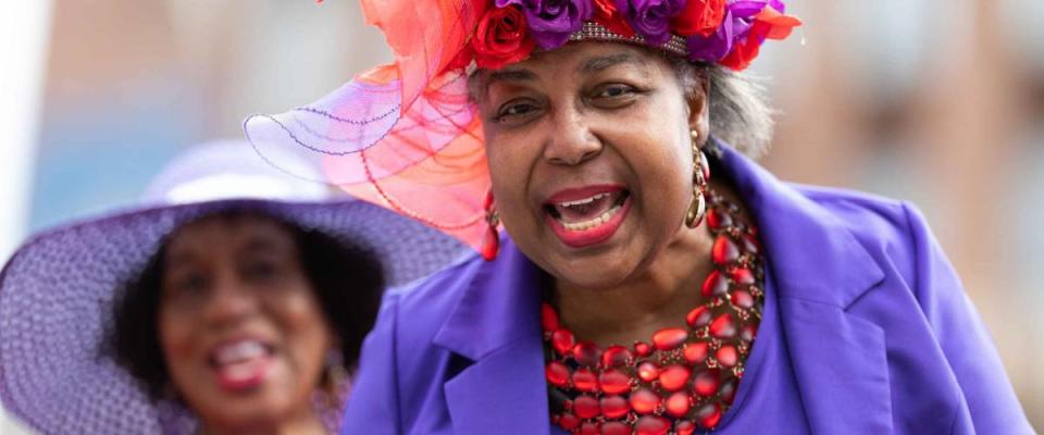 Louisville, Kentucky, USA - May 2, 2019: The Pegasus Parade, African american woman wearing a retro outfit smiling for the camera