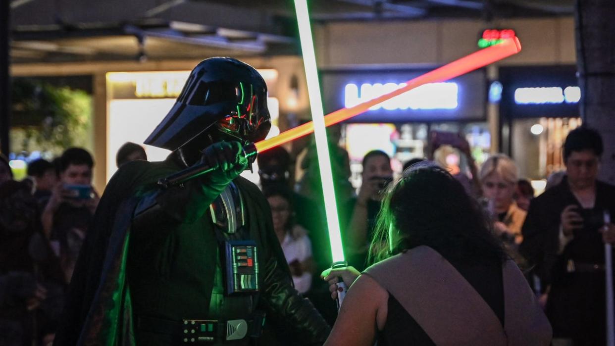 <div>Star Wars fans re-enact a scene from the film as they celebrate Star Wars Day in Manila on May 4, 2024. (Photo by JAM STA ROSA / AFP) (Photo by JAM STA ROSA/AFP via Getty Images)</div>