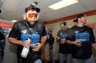 Sep 30, 2015; Baltimore, MD, USA; Toronto Blue Jays right fielder Jose Bautista (19) gets sprayed by sports during the teams celebration of winning the A.L. East division after game two of a double header in the visiting locker room at Oriole Park at Camden Yards. The Toronto Blue Jays clinched the division after game one of the double header. Tommy Gilligan-USA TODAY Sports