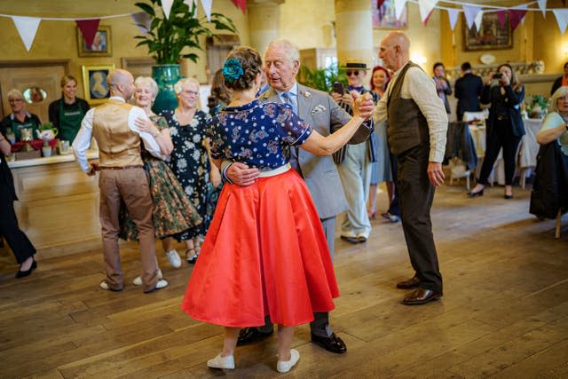 Charles dances with Bridget Tibbs 