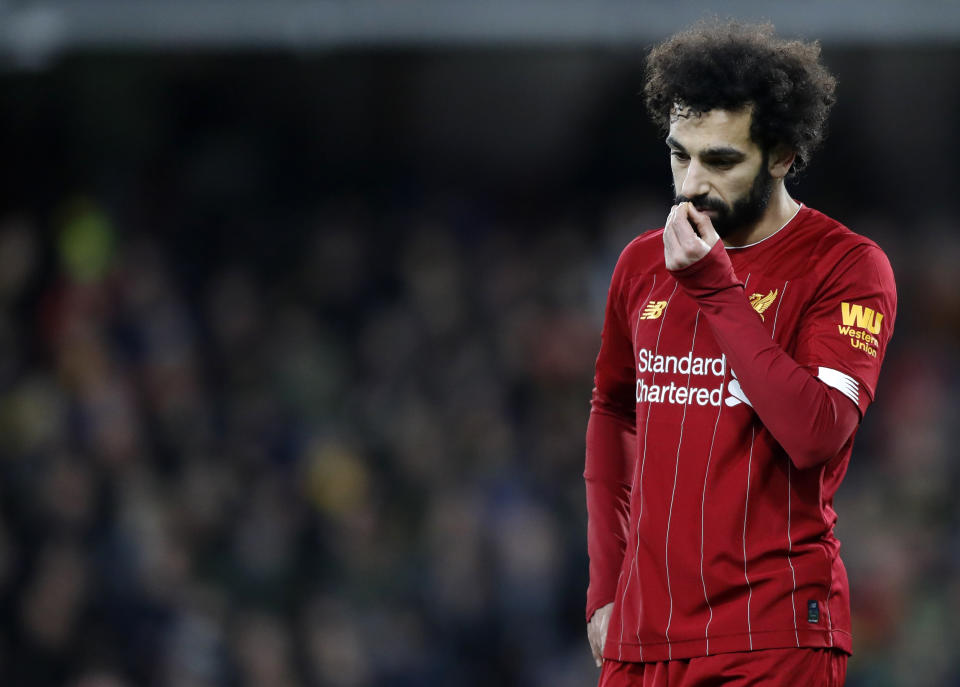 Liverpool's Mohamed Salah leaves the field at the end of the English Premier League soccer match between Watford and Liverpool at Vicarage Road stadium, in Watford, England, Saturday, Feb. 29, 2020. The match finished 3-0. (AP Photo/Alastair Grant)