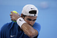 Karen Khachanov, of the Russian Olympic Committee, wipes his face during the men's single gold medal match of the tennis competition against Alexander Zverev, of Germany, at the 2020 Summer Olympics, Sunday, Aug. 1, 2021, in Tokyo, Japan. (AP Photo/Patrick Semansky)