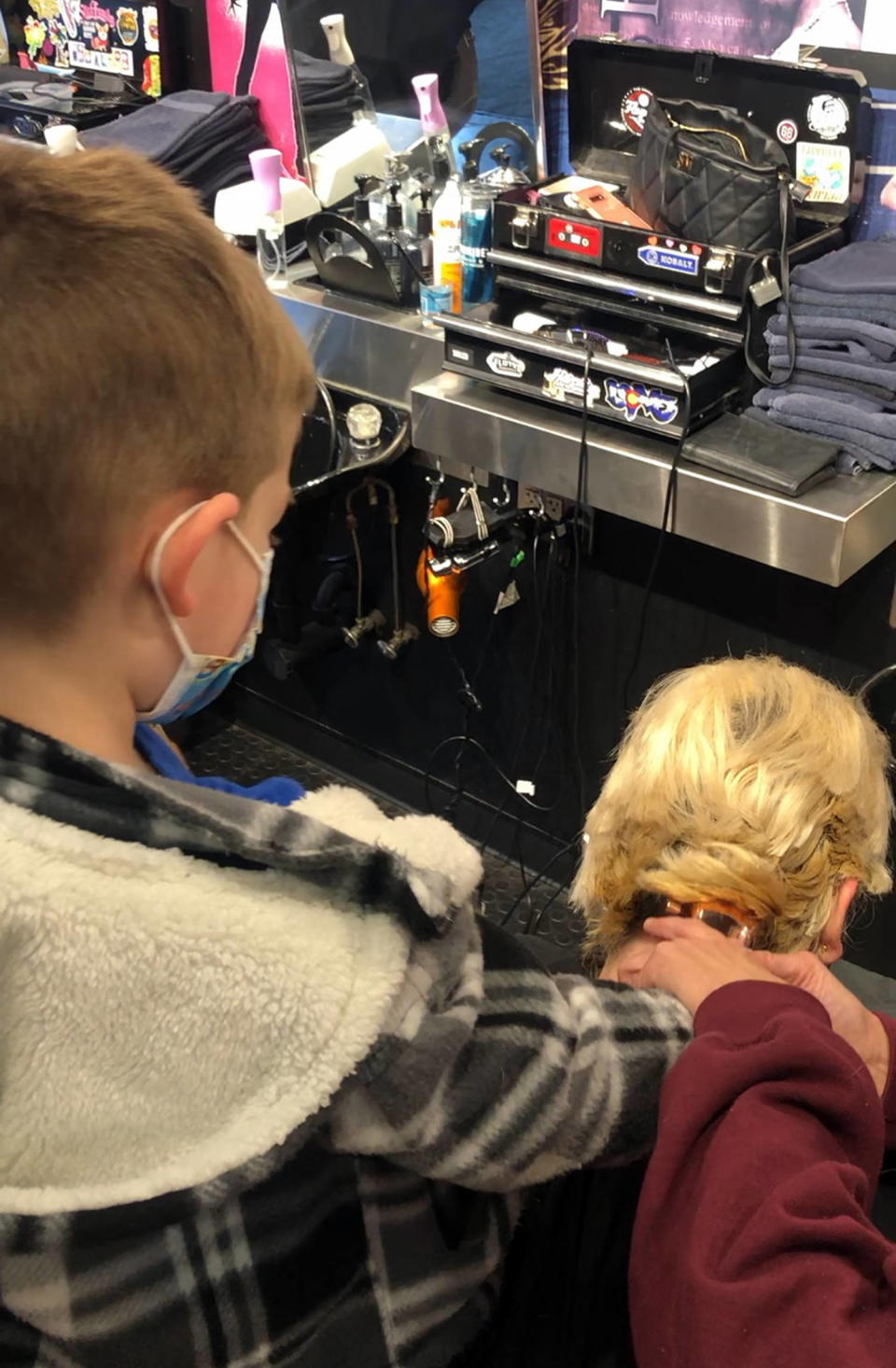 When Jenna Beyersdorf started losing her hair from chemotherapy, she decided to shave it off. She enlisted her son, Chadwick, to help her. His reaction to seeing his mom without hair was, 