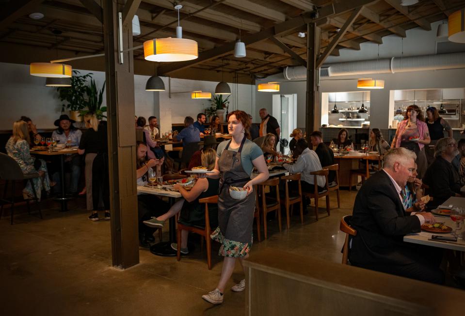 Paseo restaurant was bustling during a pre-opening 'media and influender' dinner on Tuesday evening. Paseo, located at 900 Baxter Ave., features a wood-fired stove, open kitchen concept and foods inspired by flavors of Morocco, Italy and Spain. June 27, 2023