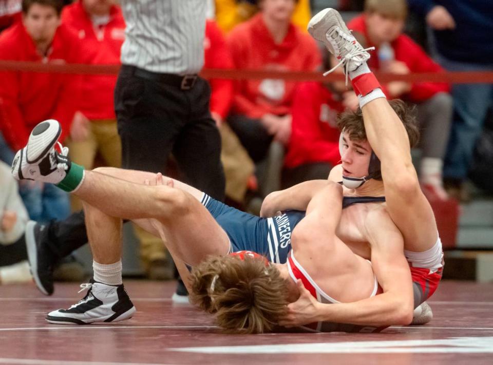 Philipsburg-Osceola’s Ben Gustkey wrestles Bellefonte’s Jackson Long in the 127 lb third place bout of the District 6 2A championships on Saturday, Feb. 18, 2023.