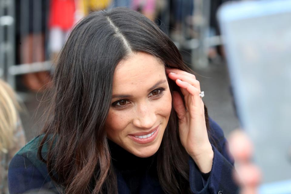 Meghan talking to a member of the public.