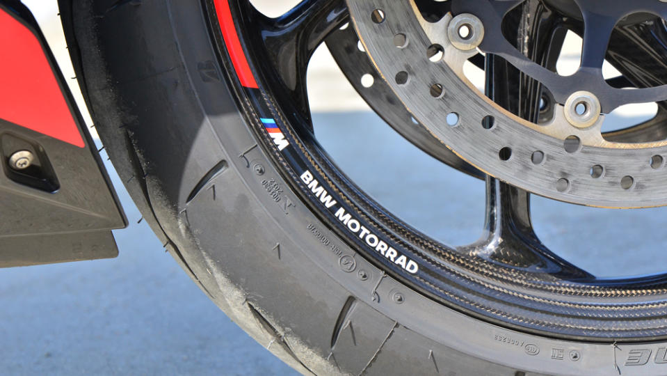 A close-up of the carbon-fiber wheels on the BMW M 1000 R M Competition motorcycle.