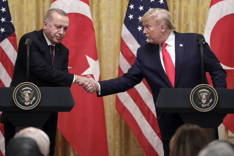 President Donald Trump shakes hands with Turkish President Recep Tayyip Erdogan during a news conference in the East Room of the White House, Wednesday, Nov. 13, 2019, in Washington. (AP Photo/ Evan Vucci)