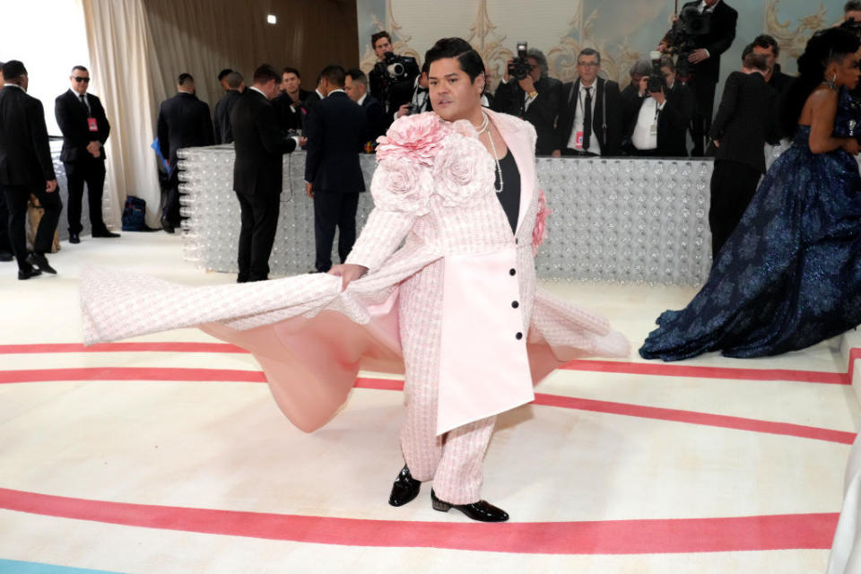 Harvey Guillén attends the 2023 Met Gala in a pastel pink suit