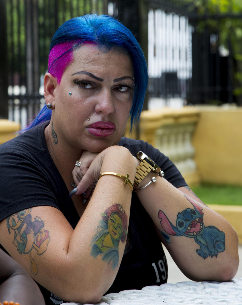 In this June 28, 2019, photo, Dianelys Alfonso, singer whose voice won her the label "Goddess of Cuba" sits during an interview with The Associated Press in Havana, Cuba. She became the center of a new phenomenon in Cuba when she publicly denounced another renowned musician, flutist and bandleader José Luis Cortés, accusing him of repeatedly hitting and raping her during her time as vocalist for NG La Banda, one of the best-known Cuban bands of the last three decades. (AP Photo/Ismael Francisco)