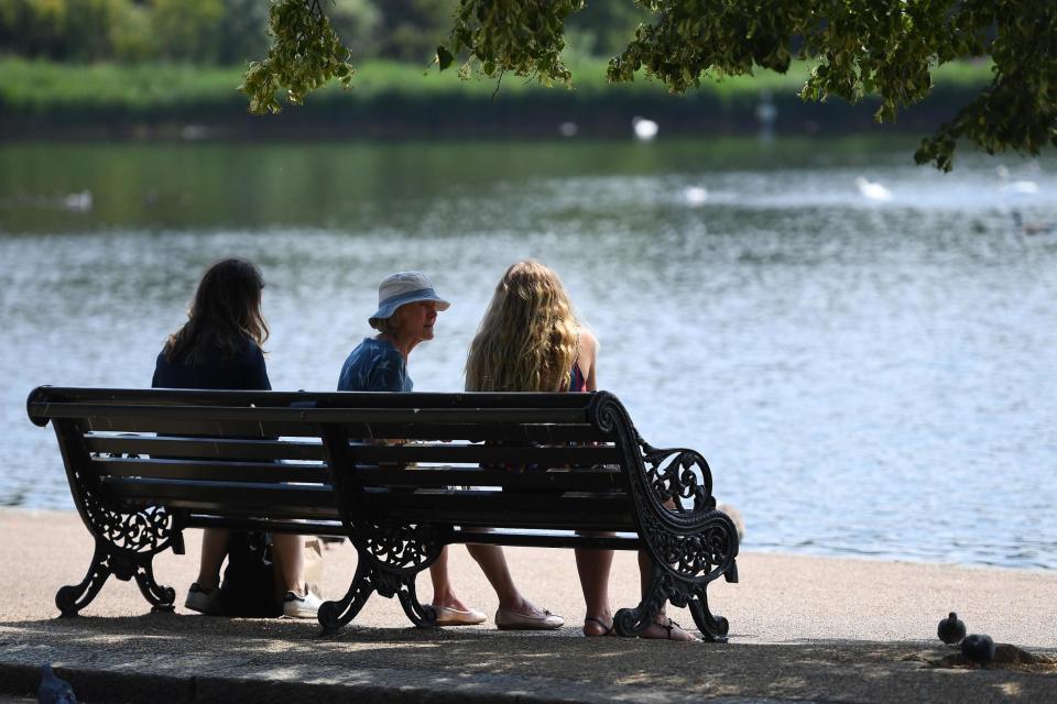 People enjoy the hot weather at Hyde Park (EPA)