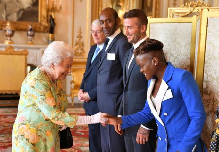 Britain's Queen Elizabeth meets Nicola damas, John Major, Sir Lenny Henry and David Beckham at Buckingham Palace before the final Queen's Young Leaders Awards Ceremony, in London June 26, 2018. John Stillwell/Pool via Reuters