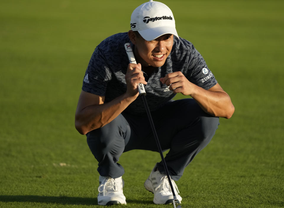 Collin Morikawa, of the United States, studies his putt on the 17th green during the first round of the Hero World Challenge PGA Tour at the Albany Golf Club, in New Providence, Bahamas, Thursday, Dec. 1, 2022. (AP Photo/Fernando Llano)