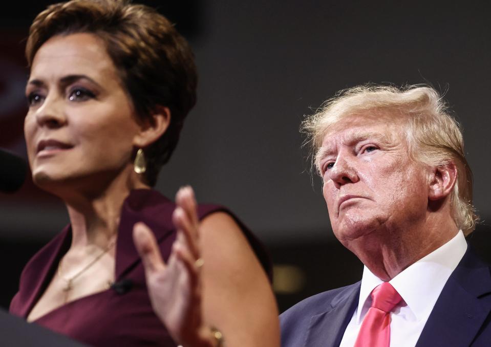 Former President Donald Trump watches Republican candidate for governor Kari Lake speak at a ‘Save America’ rally on July 22, 2022 in Prescott Valley, Arizona.