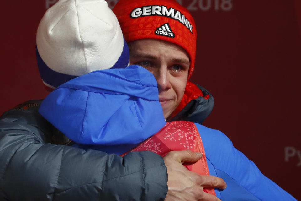 <p>Andreas Wellinger, of Germany, cries as he hugs a competitor after winning the gold medal in the men’s normal hill individual ski jumping competition at the 2018 Winter Olympics in Pyeongchang, South Korea, Sunday, Feb. 11, 2018. (AP Photo/Matthias Schrader) </p>