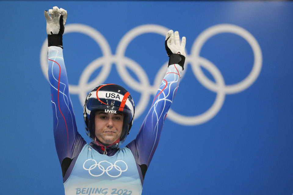 FILE - Emily Sweeney, of the United States, stretches prior the luge women's singles run 2 at the 2022 Winter Olympics, Monday, Feb. 7, 2022, in the Yanqing district of Beijing. Summer Britcher and Emily Sweeney have been USA Luge teammates for years. They’ve traveled together, they’ve competed together, they’ve gone to the Olympics together, they’ve stood on World Cup podiums together. Being on a sled together was not part of the plan.(AP Photo/Mark Schiefelbein, File)