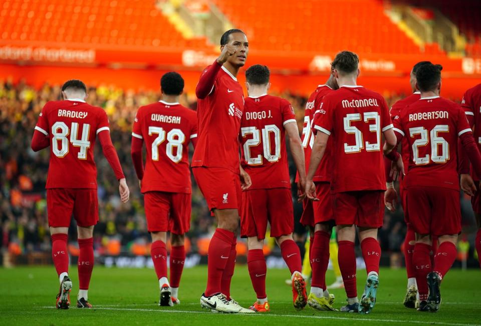 Liverpool's Virgil van Dijk celebrates scoring their side's fourth goal of the game during the Emirates FA Cup fourth-round match at Anfield (PA)