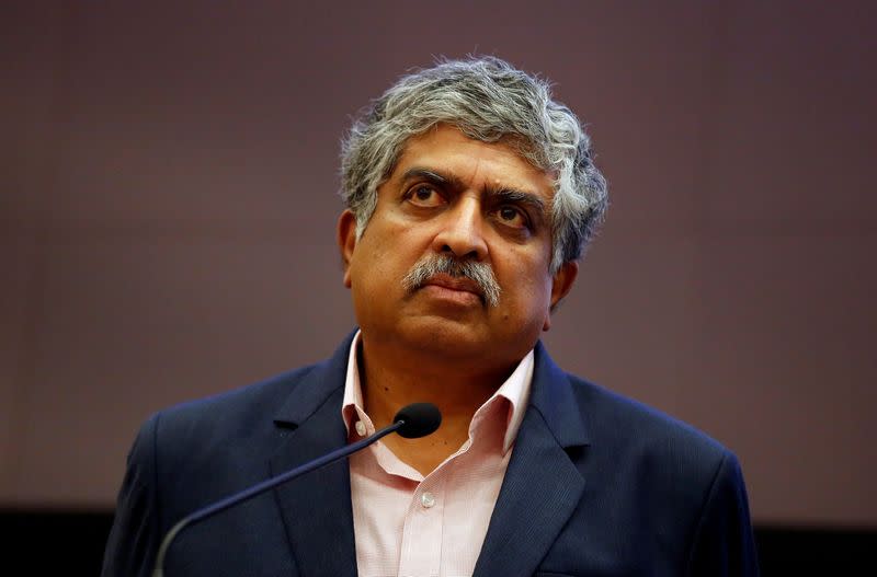 Nandan Nilekani, Co-founder and Non-Executive Chairman of Infosys listens to reporters' questions during the announcement of the company's quarterly results at its headquarters in Bengaluru