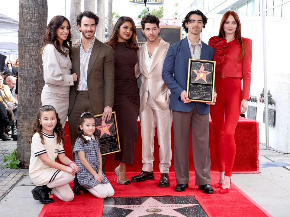 Danielle Jonas, Kevin Jonas, Priyanka Chopra, Nick Jonas, Joe Jonas, Sophie Turner, and (front) Alena Rose Jonas, and Valentina Angelina Jonas attend The Hollywood Walk of Fame star ceremony honoring the Jonas Brothers on January 30, 2023 in Hollywood, California.