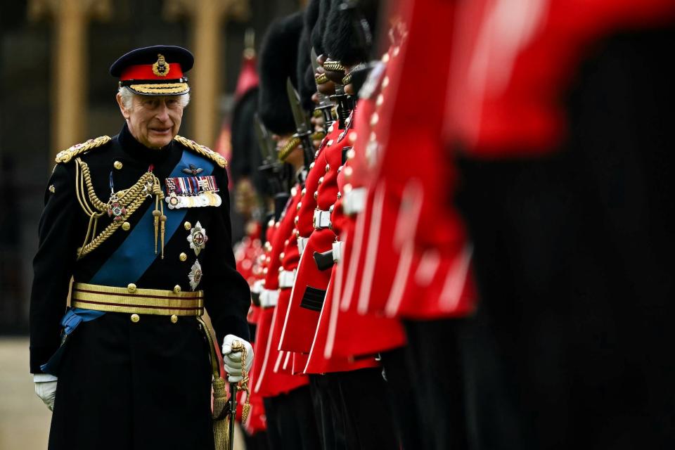 King Charles reviewing the Irish Guard in June 2024 at Windsor Castle.