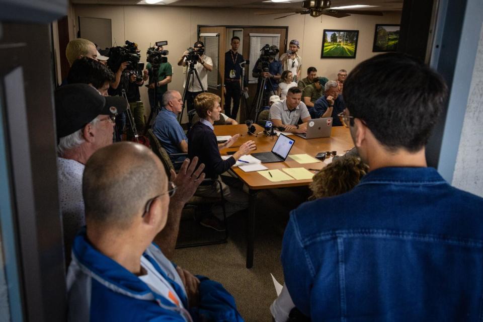 A crowded meeting room.