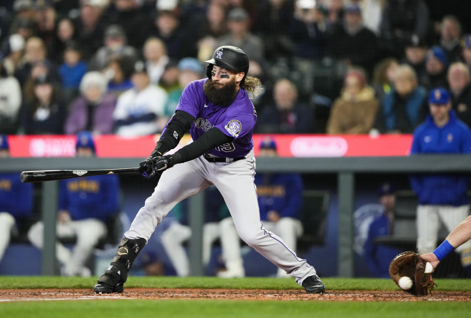 Colorado Rockies' Charlie Blackmon strikes out against Seattle Mariners starting pitcher Luis Castillo to end the fourth inning of a baseball game, Sunday, April 16, 2023, in Seattle. (AP Photo/Lindsey Wasson)