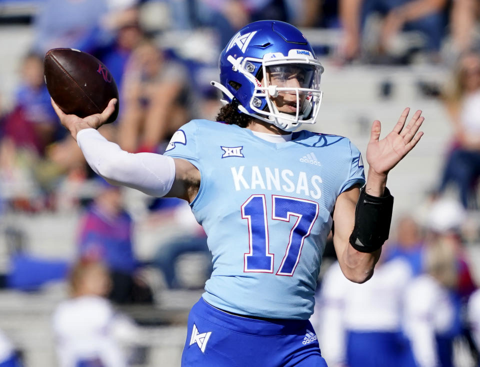 Kansas quarterback Jason Bean looks to pass against Texas Tech during in first quarter of an NCAA college football game Saturday, Oct. 16, 2021, in Lawrence, Kan. (AP Photo/Ed Zurga)