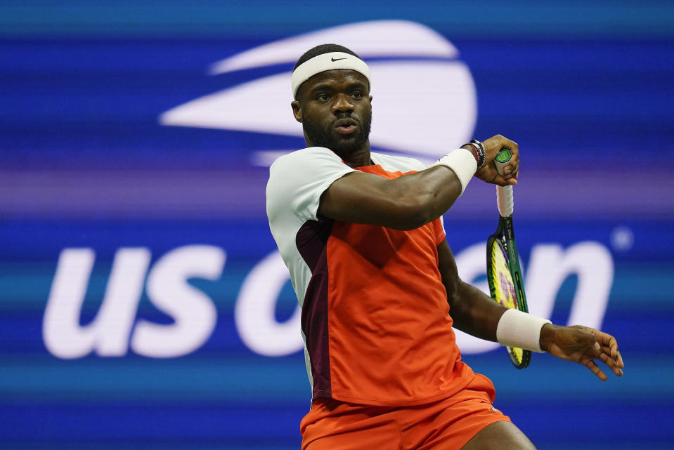 FILE - Frances Tiafoe, of the United States, follows through on a shot to Carlos Alcaraz, of Spain, during the semifinals of the U.S. Open tennis championships, Sept. 9, 2022, in New York. Tiafoe came close to becoming the first American man to win a Grand Slam singles title since Andy Roddick at the 2003 U.S. Open, and that drought will be a topic of conversation at this year's U.S. Open, which starts Monday, Aug. 28, 2023. (AP Photo/Charles Krupa, File)