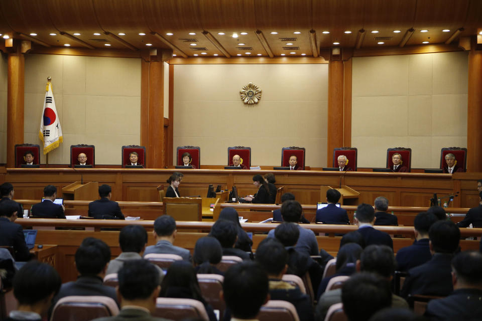 Nine judges of South Korea's Constitutional Court sit during the first hearing arguments for South Korean President Park Geun-hye's impeachment trial at the Constitutional Court in Seoul, South Korea, Tuesday, Jan. 3, 2017. (Kim Hong-ji/Pool Photo via AP)