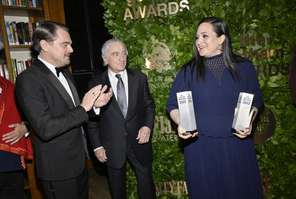 Leonardo DiCaprio, left, Robert De Niro and Lily Gladstone pose with the Gotham historical icon & creator tribute for "Killers of the Flower Moon," at the Gotham Independent Film Awards at Cipriani Wall Street, Monday, Nov. 27, 2023, in New York. (Photo by Evan Agostini/Invision/AP)