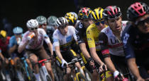 Slovenia's Tadej Pogacar, wearing the overall leader's yellow jersey, follows Richard Carapaz of Ecuador, right, Poland's Rafal Majka, second right, and is followed by Belgium's Wout Van Aert, Denmark's Jonas Vingegaard, wearing the best young rider's white jersey, and Australia's Ben O'Connor, drinking, as they climb during the eighteenth stage of the Tour de France cycling race over 129.7 kilometers (80.6 miles) with start in Pau and finish in Luz Ardiden, France,Thursday, July 15, 2021. (AP Photo/Christophe Ena)