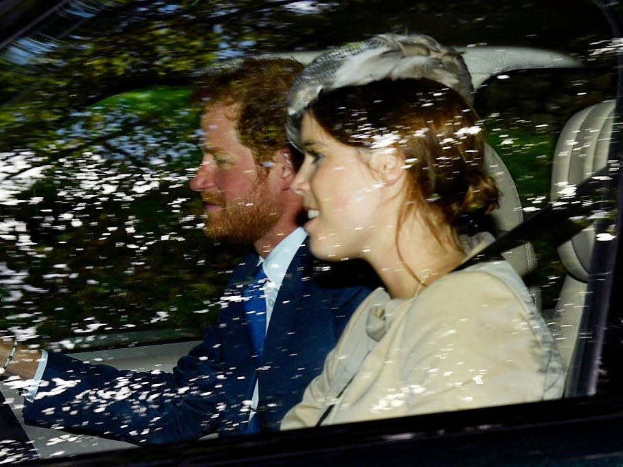 Princess Eugenie rides with Prince Harry in a car at Balmoral Castle in 2016.