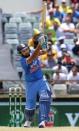 India's Rohit Sharma hits a six during the One Day International cricket match against Australia in Perth January 12, 2016. REUTERS/Bill Hatto