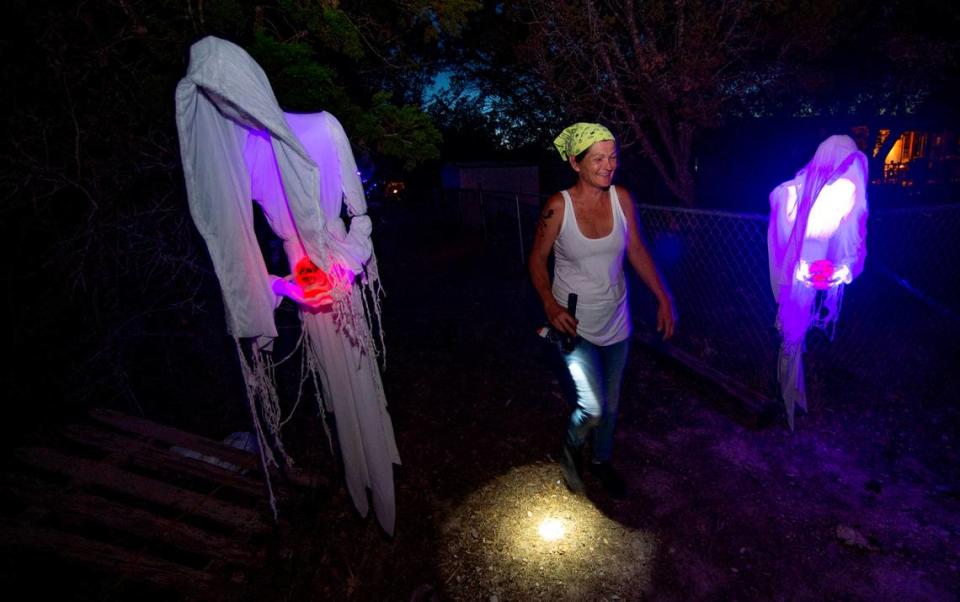 Chris Caughlan walks a trail of horrors at her Granbury property. Her Halloween-themed event offers nearly 100 figures and all donations she gives to the Hood County Station 70 VFD.