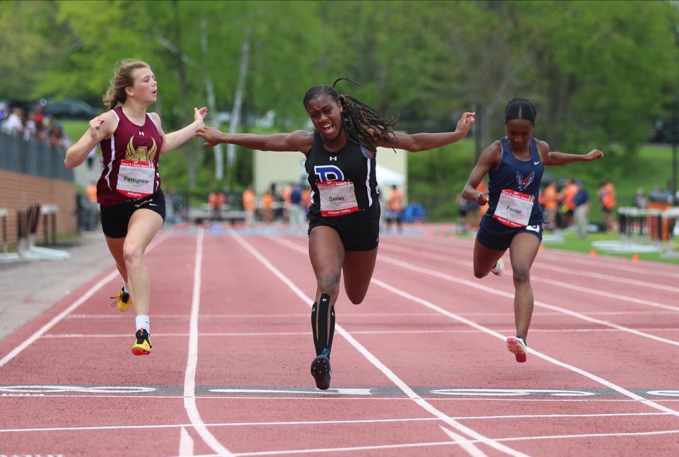 Arlington's Riley Pettigrew, left, and Putnam Valley's Nia Givan run the 100-meter dash preliminaries during Day 3 of the Loucks Games track and field meet at White Plains High School on Saturday, May 14, 2022.