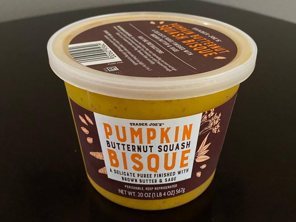 Trader Joe's container of pumpkin bisque on table