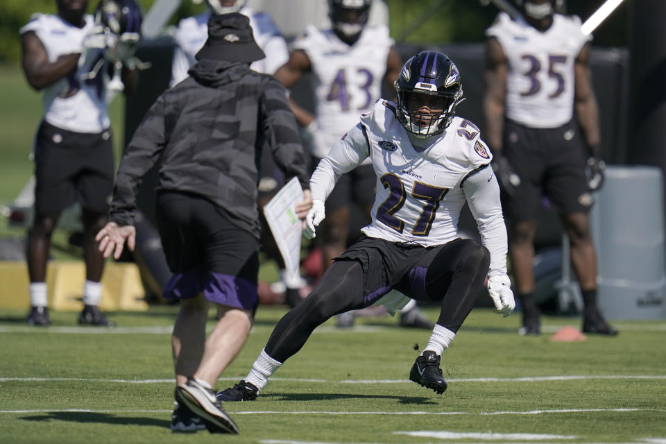 Baltimore Ravens running back J.K. Dobbins works out during the team's NFL football training, Tuesday, June 15, 2021, in Owings Mills, Md. (AP Photo/Julio Cortez)