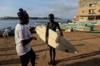 Wider Image: Meet Senegal's first female pro surfer inspiring girls to take to the waves