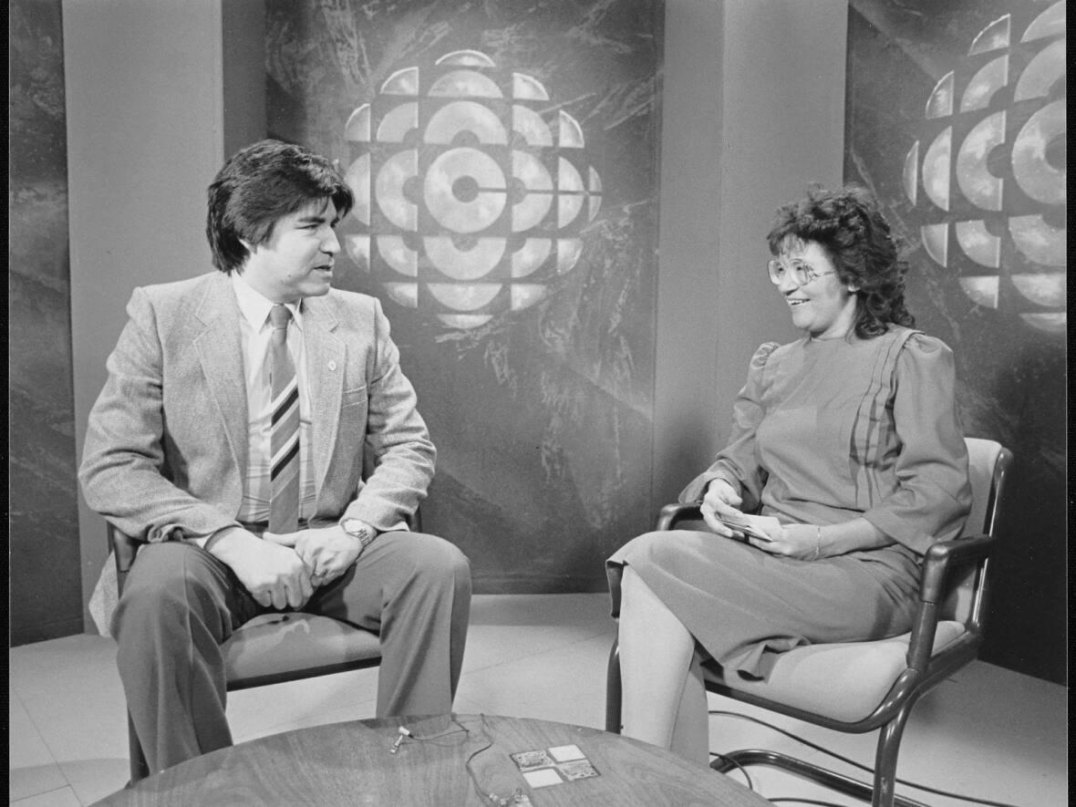 Cree Grand Chief Ted Moses, left, and Dianne Ottereyes Reid, right, pictured at a taping of CBC North's Cree-language television show, Maamuitaau in the mid-1980s. CBC North's Cree-language radio and television broadcasts celebrated 50th and 40th anniversaries respectively in November. (Maamuitaau/ CBC North - image credit)