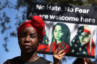 <p>Santcha Etienne joins other women on International Women’s Day in front of the U.S. Department of Homeland Security Immigration and Immigration and Customs Enforcement (ICE) office to ask for fair treatment and dignity for women who are called to the office for immigration interviews. (Photo: Joe Raedle/Getty Images) </p>