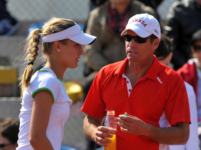 FILE PHOTO: Canada's head coach Sylvain Bruneau speaks with Eugenie Bouchard during her Fed Cup World Group tennis match against Slovenia's Polona Hercog in Koper