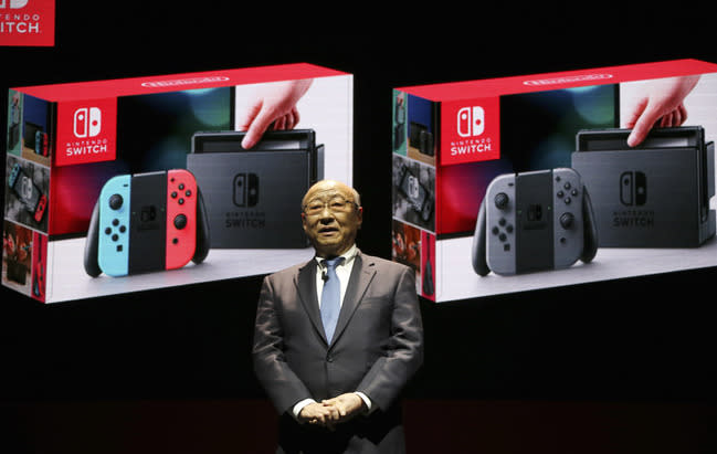 Nintendo president Tatsumi Kimishima speaking at the launch of the new console (Rex)