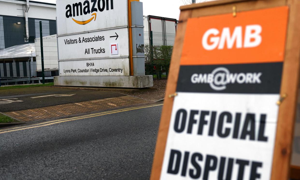 <span>A GMB sign seen during industrial action outside the Amazon warehouse in Coventry in March 2024.</span><span>Photograph: Molly Darlington/Reuters</span>