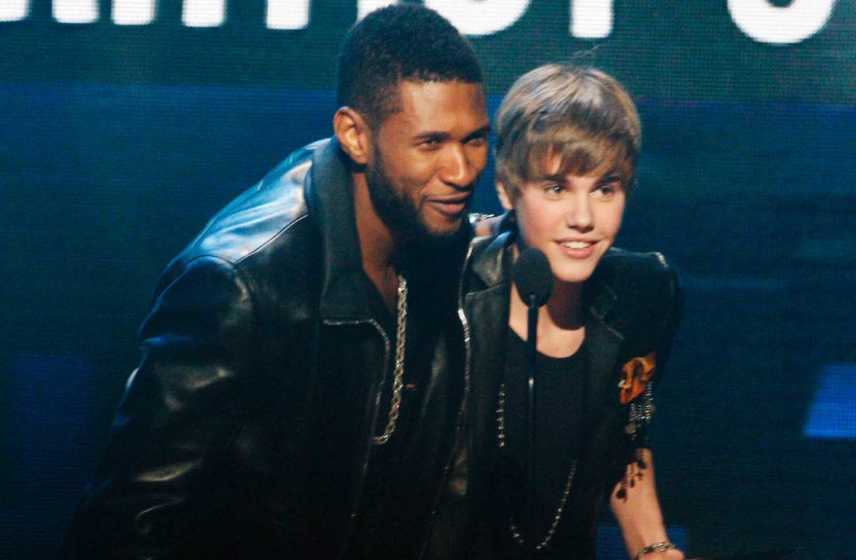 Usher and Justin Bieber at the American Music Awards in November 2010<p>Tim Ogier/Disney General Entertainment Content via Getty Images</p>