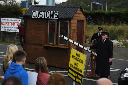 FILE PHOTO: Anti-Brexit campaigners, Borders Against Brexit, set up a mock customs hut during a protest against Britain's vote to leave the European Union, at the border town of Carrickcarnon in Ireland October 8, 2016. REUTERS/Clodagh Kilcoyne/File Photo