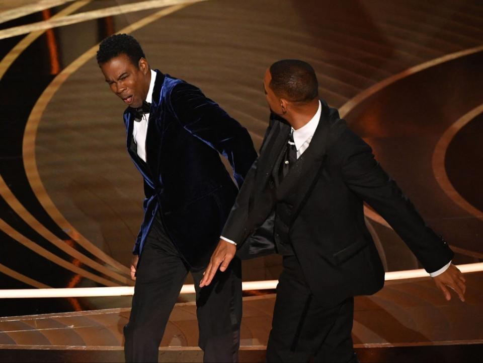 Will Smith hit Chris Rock at the 2022 Oscars ceremony (AFP via Getty Images)