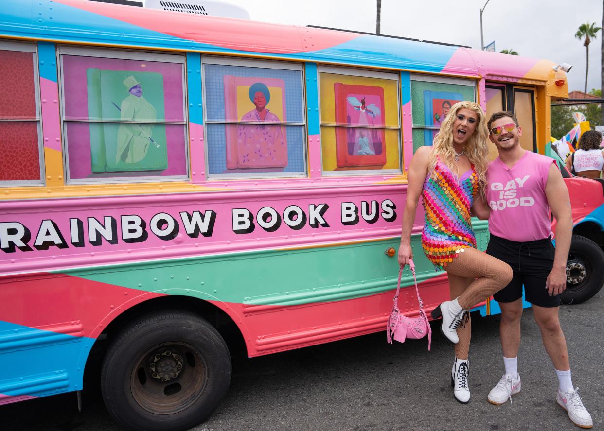 Rainbow Books Bus co-founders Adam Powell and Eric Cervini debut the bust at the L.A. Pride Parade in Los Angeles, California June 11, 2023.