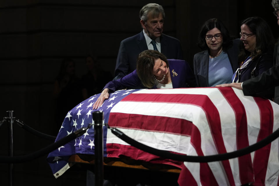 U.S. Rep. Nancy Pelosi, D-Calif. second from left, surrounded by her husband Paul, left, Katherine Feinstein, second from right, and daughter Nancy Pelosi, right, blows a kiss at the casket of U.S. Sen. Dianne Feinstein at the City Hall Wednesday, Oct. 4, 2023, in San Francisco. Feinstein, who died Sept. 29, served as San Francisco's mayor. (AP Photo/Godofredo A. Vásquez)