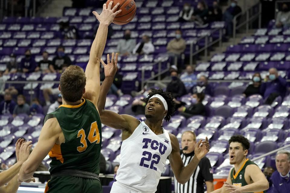 North Dakota State forward Rocky Kreuser (34) blocks a shot attempt by TCU guard RJ Nembhard (22) during the second half of an NCAA college basketball game in Fort Worth, Texas, Tuesday, Dec. 22, 2020. (AP Photo/Tony Gutierrez)